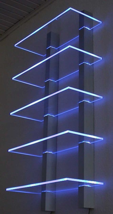 a tall building with blue lights on it's sides