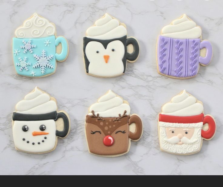 decorated sugar cookies with frosting and icing on a marble countertop for christmas