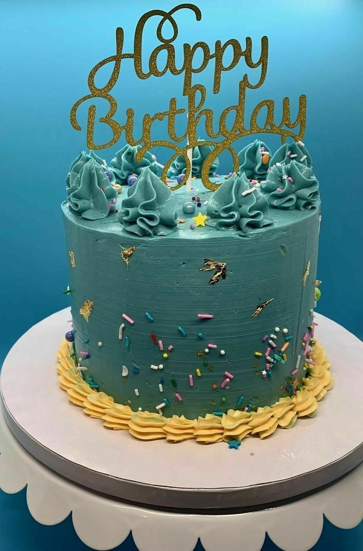 a birthday cake with blue frosting and sprinkles