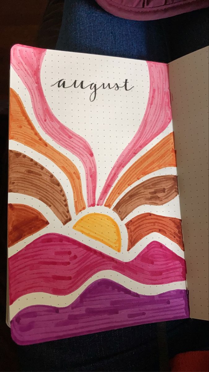 August Bullet Journal cover page. Title is “august” and is surrounded by a drawing of an alternative style of sunset over mountains. Mountains are pink and purple with the sun rays differing shades of brown. August Journal Ideas Aesthetic, Notebook Cover Painting Ideas Easy, Art Book Cover Ideas Drawing School, August Scrapbook Ideas, August Bullet Journal Cover Easy, Easy Aesthetic Drawings With Color, Pretty Journal Covers, Sunset Bullet Journal, Journal Ideas August