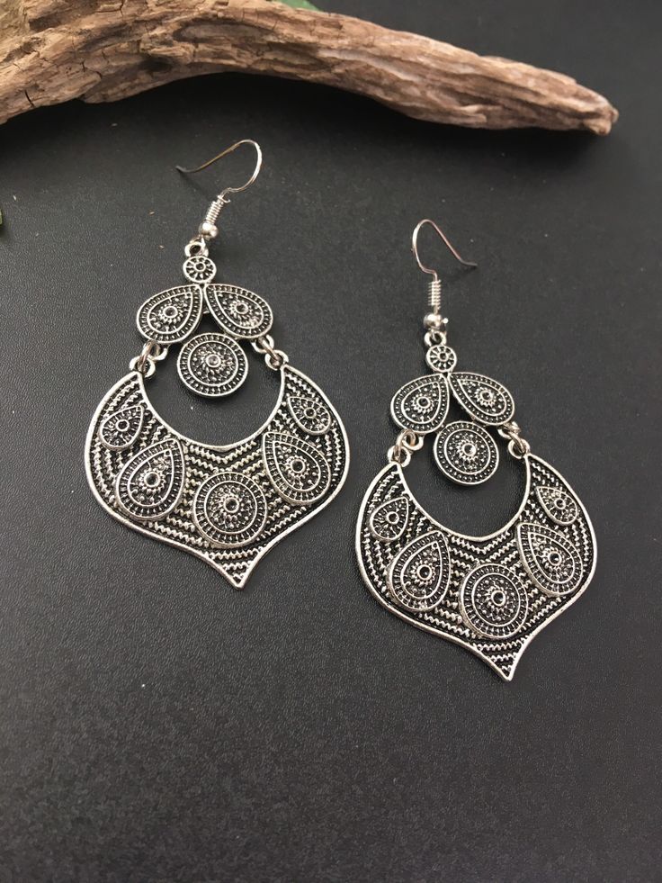 Indus Earrings : Back to our Roots. For the women who makes a statement.  An exclusive shop for earrings. Wear them with pride.  These are dangling drops style earrings . An unique handmade Indian style ethnic bohemian/ Tribal earrings in silver shade.  These earrings are made from high quality Tatanium / German silver material  which are hypoallergenic and free from corrosion & rusting.  Notes : The product shipped will be same as shown in the picture, however the actual colours may vary slightly due to the natural lighting in the photography. We do not accept returns or refunds , however in case of any issues we will definitely try and resolve it. Bohemian Metal Plug Earrings For Pierced Ears, Bohemian Silver Teardrop Earrings, Bohemian Metal Chandelier Earrings With Ear Wire, Metal Teardrop Dangle Earrings For Festivals, Festival Metal Teardrop Dangle Earrings, Nickel-free Bohemian Chandelier Earrings, Bohemian Metal Plug Earrings With Ear Wire, Bohemian Teardrop Oxidized Earrings, Bohemian Teardrop Chandelier Earrings For Pierced Ears