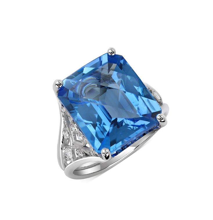 This very attractive blue topaz ring is set on 14K white gold.  Center stone blue topaz weighs 11.31 ct surrounded by 0.46 ct diamonds Metal: 14K white gold Metal weight: 6.8 g Center Stone: Blue Topaz Stone Weight: 11.31 ct Stones: Diamonds Stone weight: 0.46 ct Style: BHH-346 This ring design is available for custom order with different center stone and metal. If you are interested or have any questions, please call us we are happy to help. Thank you and have a great day. Blue Topaz Stone, Topaz Stone, Blue Topaz Ring, Topaz Ring, Diamond Stone, Have A Great Day, Blue Topaz, Ring Designs, Gold Metal