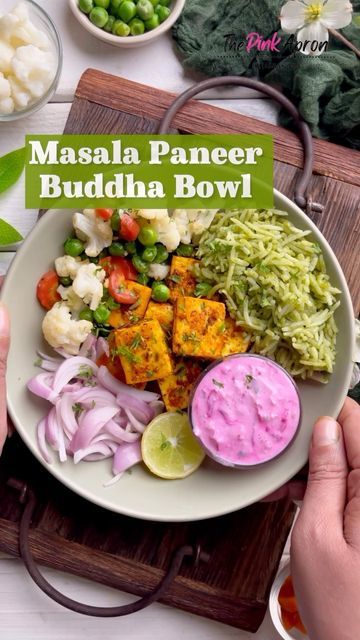 a bowl filled with food on top of a wooden cutting board next to bowls of vegetables