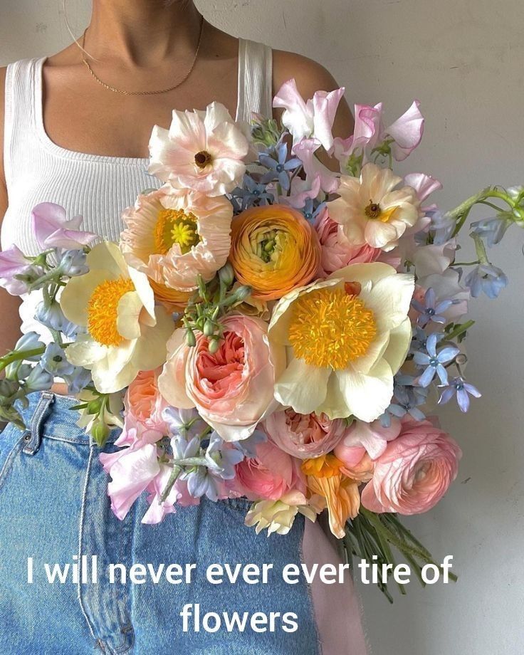 a woman holding a bouquet of flowers with the words i will never ever tire of flowers