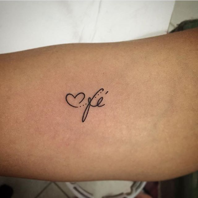 a woman's arm with the word life written in cursive font