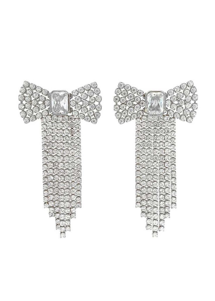 These glittering Crystal Bow Earrings will take your party look to the next level! Crafted with sparkling cz stones in a bow shape and an emerald-cut cz in the center, you'll be sure to impress with these fun and feminine statement earrings! Rhodium silver plated brass, CZ. Just over an inch wide and 1.75" long. Center CZ is 5 x 8mm. Chic Rhinestone Earrings For Gift, Party Crystal Bling Earrings With Cubic Zirconia, Party Jewelry With Diamond Bow, Cubic Zirconia Crystal Earrings For Party, Party Diamond Bow Jewelry, Silver Earrings With Decorative Bow For Evening, Silver Evening Earrings With Decorative Bow, Glamorous Silver Earrings With Bow, Formal Bow Earrings With Cubic Zirconia