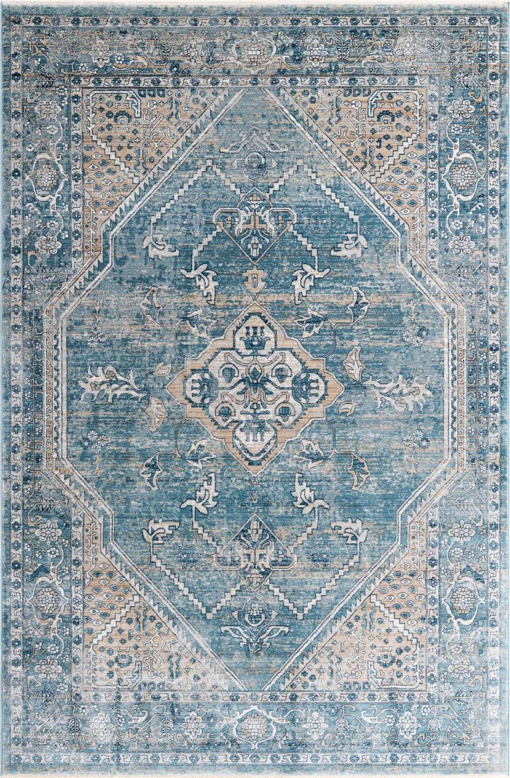 a blue and beige rug with an ornate design