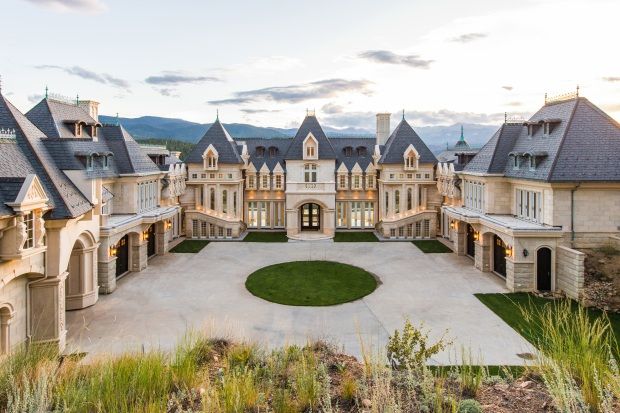 an aerial view of a large mansion with many windows