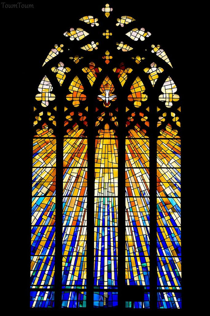 a large stained glass window in a church