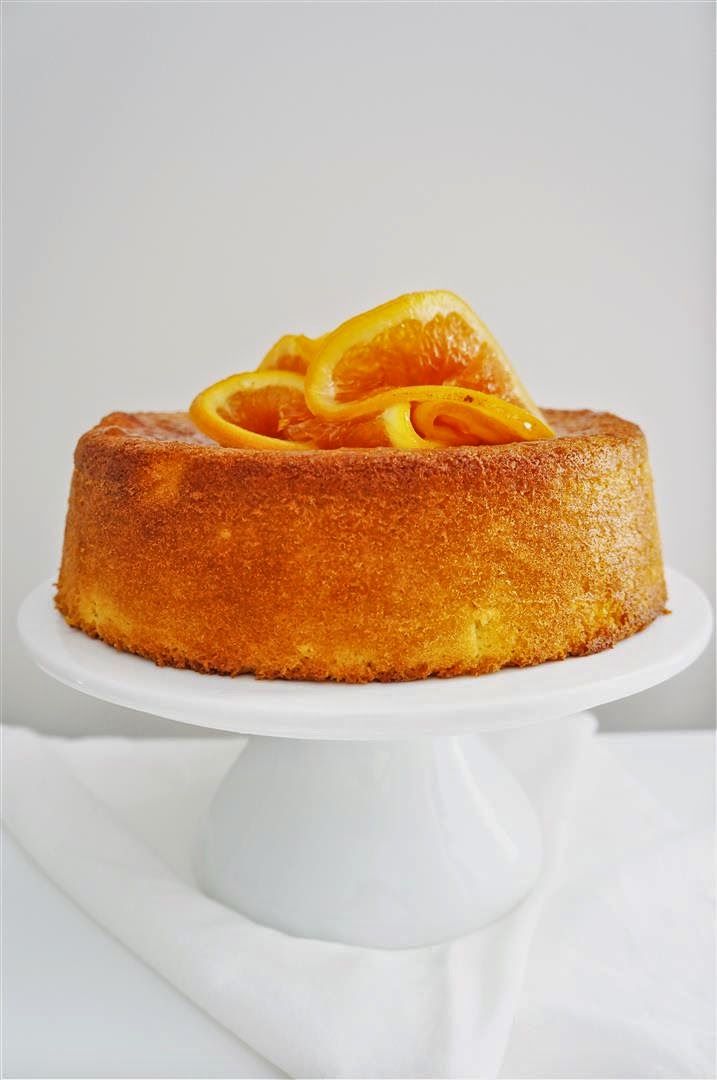 a cake with orange slices on top of it