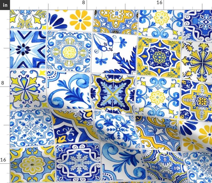 a blue and yellow patchwork fabric with flowers on it