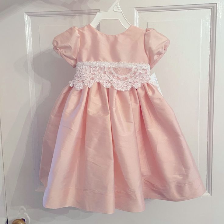 Nwt Pink Polyester Dress With Lace And Pearl Buttons. Size 9 Months Spring Princess Style Fitted Baptism Dress, Princess Style Fitted Baptism Dress For Spring, Fitted Princess Baptism Dress For Spring, Fitted Princess Dress With Lace Trim, Fitted Pink Princess Dress With Lace Trim, Fitted Baptism Dress For Spring, Fitted Short Sleeve Princess Dress For Baptism, Cute Fitted Dress For Baptism, Pink Short Sleeve Fitted Baptism Dress