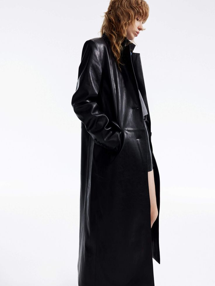 MO&Co. Women's Long Line Leather Coat Indulge in luxury with our overcoat. Crafted from comfortable and glossy faux leather, this coat features a straight and structured silhouette with padded shoulders and a single-button closure. With its chic and sophisticated design, it's the epitome of style and elegance. Features : - Structured straight-cut maxi silhouette- Padded shoulder, classic lapel collar- Single-breasted, side flap pockets Code: MBD1OVC007The back length of size S is 116cmMATERIALS Modern Leather Outerwear For Evening, Modern Leather Evening Outerwear, Sleek Leather Outerwear For Evening, Sleek Leather Evening Outerwear, Sleek Winter Leather Jacket With Button Closure, Sleek Leather Outerwear For Work, Sleek Leather Outerwear With Hidden Button Closure, Sleek Long Coat For Workwear, Sleek Long Coat For Work