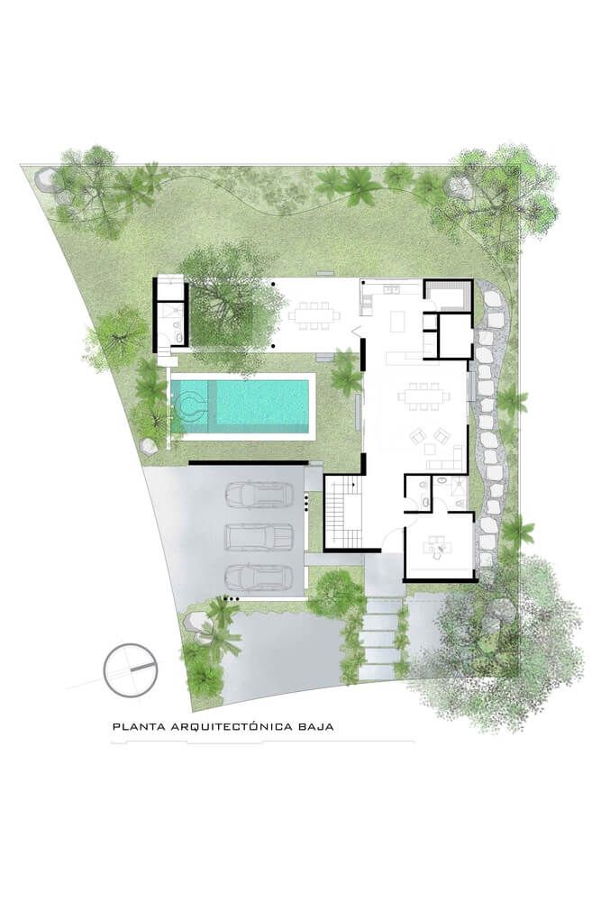 an aerial view of a house with swimming pool in the center and trees surrounding it