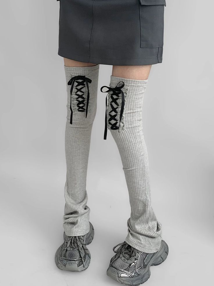 Add a touch of elegance and warmth to your outfit with our Gray/Black Lace-up Detail Leg Warmers. Designed for both style and comfort, these leg warmers feature intricate lace-up detailing that sets them apart from the ordinary. The soft, stretchy fabric ensures a snug fit while providing maximum coziness. Winter Knee-high Lace-up Boots, Trendy Fitted Lace-up Boots For Winter, Trendy Winter Fitted Lace-up Boots, Winter Trendy Fitted Lace-up Boots, Winter Fitted Bottoms Over The Knee, Fitted Casual Lace-up Boots For Fall, Casual Fitted Lace-up Boots For Fall, Fitted Over-the-knee Winter Bottoms, Spring Gray Leg Warmers