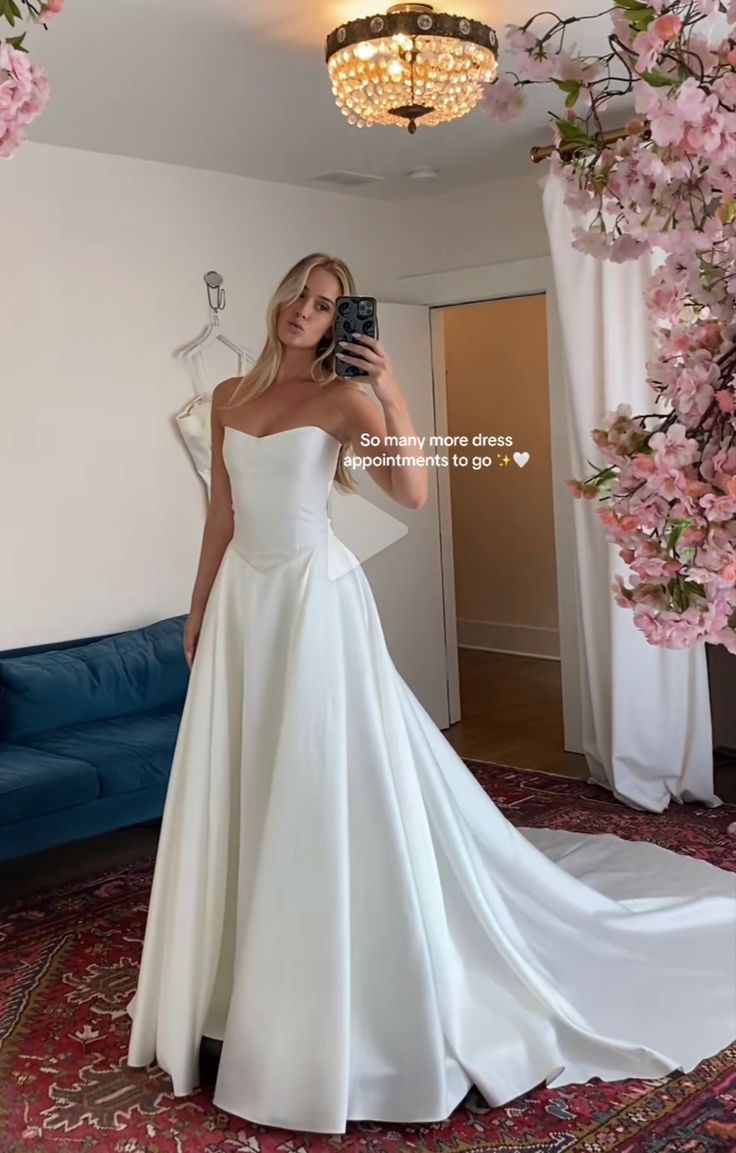 a woman taking a selfie in her wedding dress