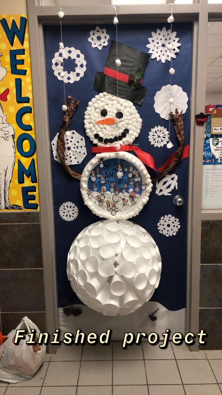 a door decorated to look like a snowman