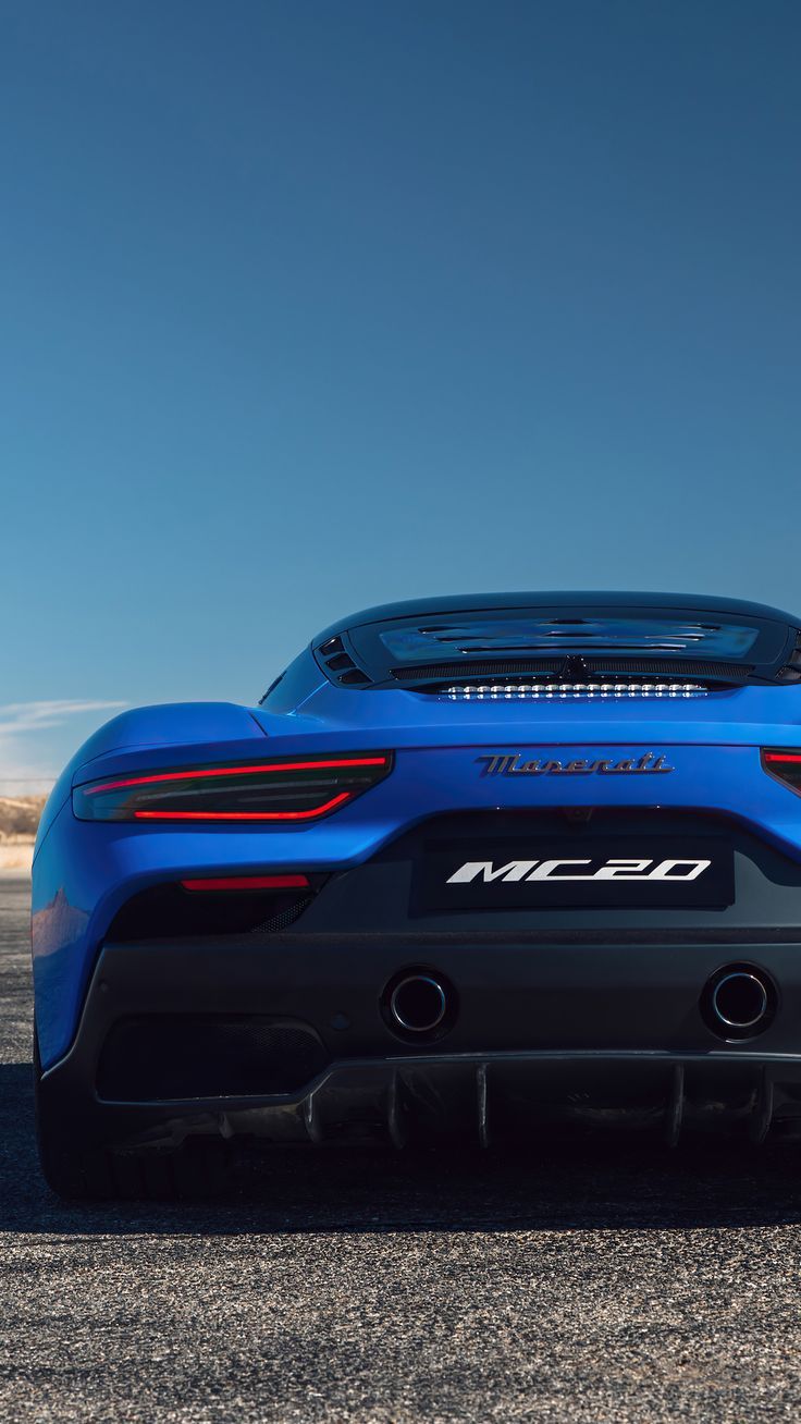 the rear end of a blue sports car