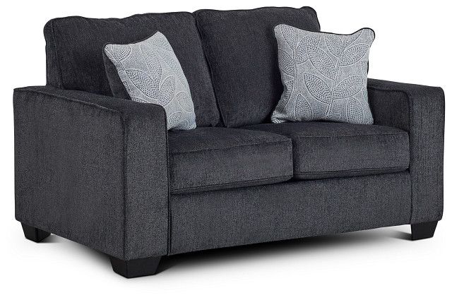 a gray couch with two pillows on it