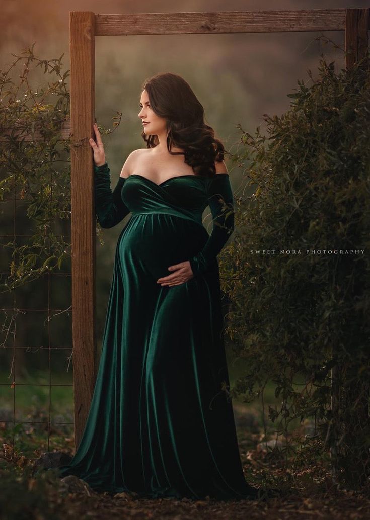 The Darah Gown features an off the shoulders cut with long sleeves and a half circle skirt with a wrap style leg slit. MATERIAL / Stretchy Velvet COVERAGE / Non See Through PROCESSING TIME / READY TO SHIP Emerald Green Maternity Dress, Green Maternity Dress, Maternity Shoot Dress, Velvet Maternity Dress, Gown For Pregnant Women, Green Maternity Dresses, Dress For Pregnant Women, Maternity Dresses Photography, Maternity Photography Props