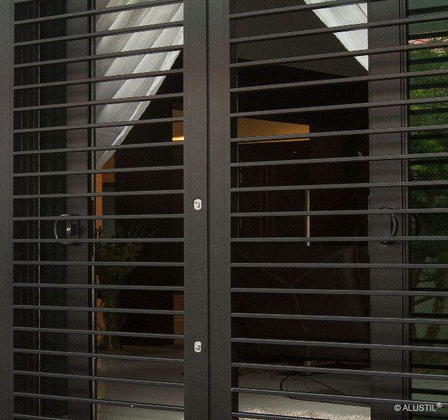 an open door with metal slats on it