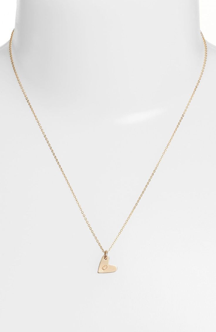 From humble beginnings to a fully staffed warehouse in Oregon, Nashelle remains true to its original purpose-handmade jewelry crafted with love and intention. The heart initial necklace is no different-with a hand-stamped pendant anchored by a single ring, it makes for a perfect layering piece. Style Name:Nashelle 14K-Gold Fill Initial Mini Heart Pendant Necklace. Style Number: 5143637. Available in stores. Dainty Heart Pendant Initial Necklace For Everyday, Dainty Heart Initial Pendant Necklace For Everyday, Everyday Dainty Heart Pendant Initial Necklace, Delicate Heart Charm Initial Pendant Necklace, Delicate Necklace With Heart Charm And Initial Pendant, Delicate Initial Pendant Necklace With Heart Charm, Minimalist Heart Charm Jewelry For Anniversary, Minimalist Heart Charm Jewelry For Anniversary Gift, Rose Gold Necklace With Heart Charm And Initial Pendant