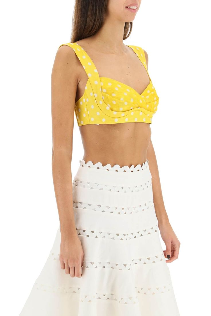 Zimmermann bralette top in polka dot linen and silk organza enhanced by a pleated design. It features wide adjustable straps, underwired molded cups and a smocked back insert. Hook-and-eye fastening. The model is 177 cm tall and wears a size 1 Zimmermann. Size Info STANDARD Color Detail Yellow Made In China Material 53% LI 47% SE Season One spring Season Two summer Product clothing Brand Zimmermann Size And Fit Cropped Bra With Removable Pads For Summer, Chic Crop Top With Adjustable Straps And Underwire, Chic Cropped Bra With Removable Pads, Chic Summer Bra With Removable Pads, Chic Bra With Removable Pads For Summer, Summer Tops With Adjustable Straps And Underwire, Summer Bandeau Bra With Removable Pads, Summer Underwire Tops With Adjustable Straps, Fitted Summer Bra With Removable Straps