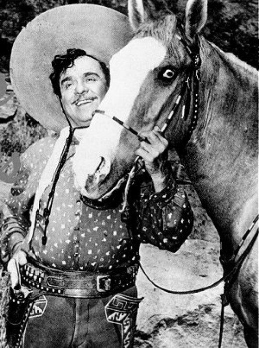 an old photo of a man in cowboy attire holding a horse's bridle