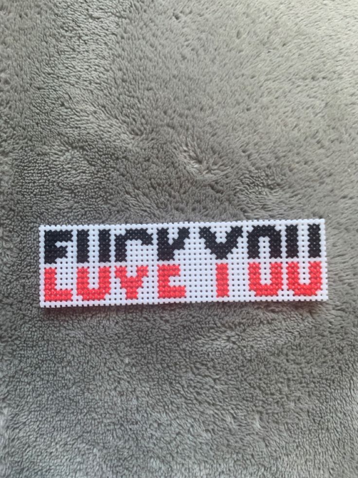 a sticker that says,'i love you'in red and black letters