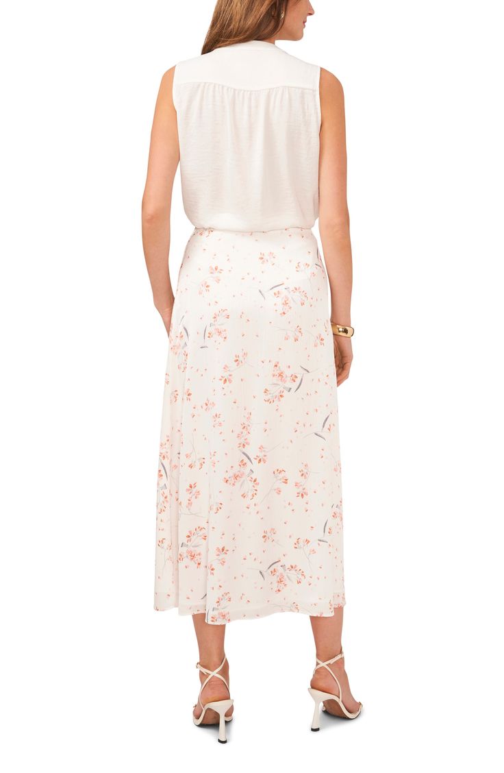 Delicate flowers pattern this elegant and understated midi skirt with an A-line silhouette. 35" length (size Medium) Lined 100% polyester Machine wash, line dry Imported Relaxed Floral Print Midi Skirt, Floral Print Relaxed Fit Midi Skirt, Floral Print Midi Length Skirt, Flowy Floral Print Maxi Skirt, Flowy Floral Print Rayon Skirt, Floral Print Rayon Midi Skirt, Spring Daywear Rayon Maxi Skirt, Flowy Viscose Maxi Skirt For Spring, Feminine Floral Print Flared Maxi Skirt