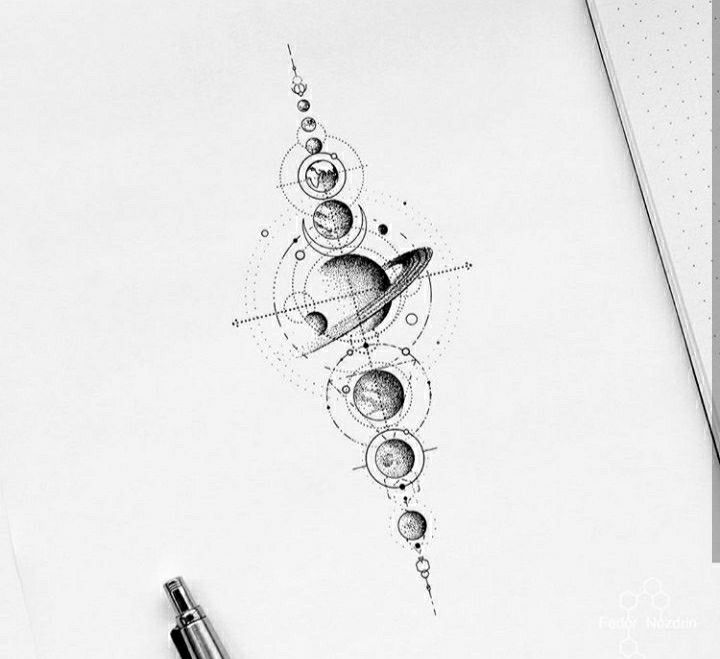 a pencil drawing of the planets and stars on paper with a pen next to it