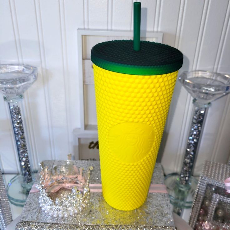 a yellow cup sitting on top of a table