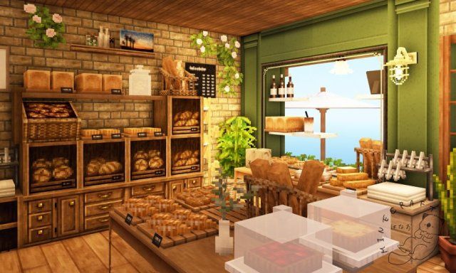 the interior of a bakery with breads and pastries on display in boxes next to an open window