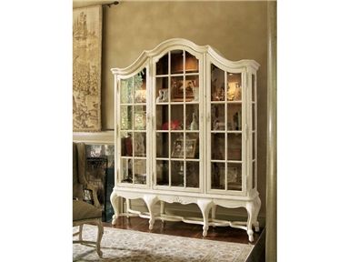 a white china cabinet sitting on top of a hard wood floor