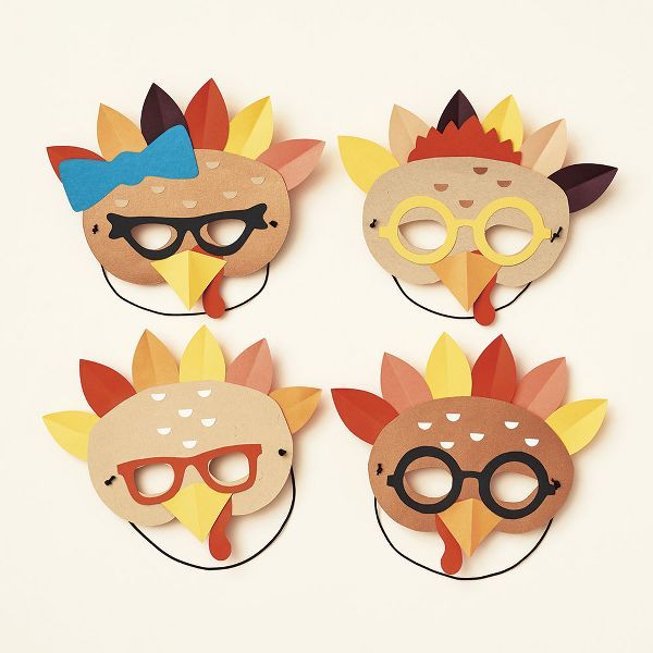 four masks with different designs on them, one is wearing glasses and the other has a bird's head