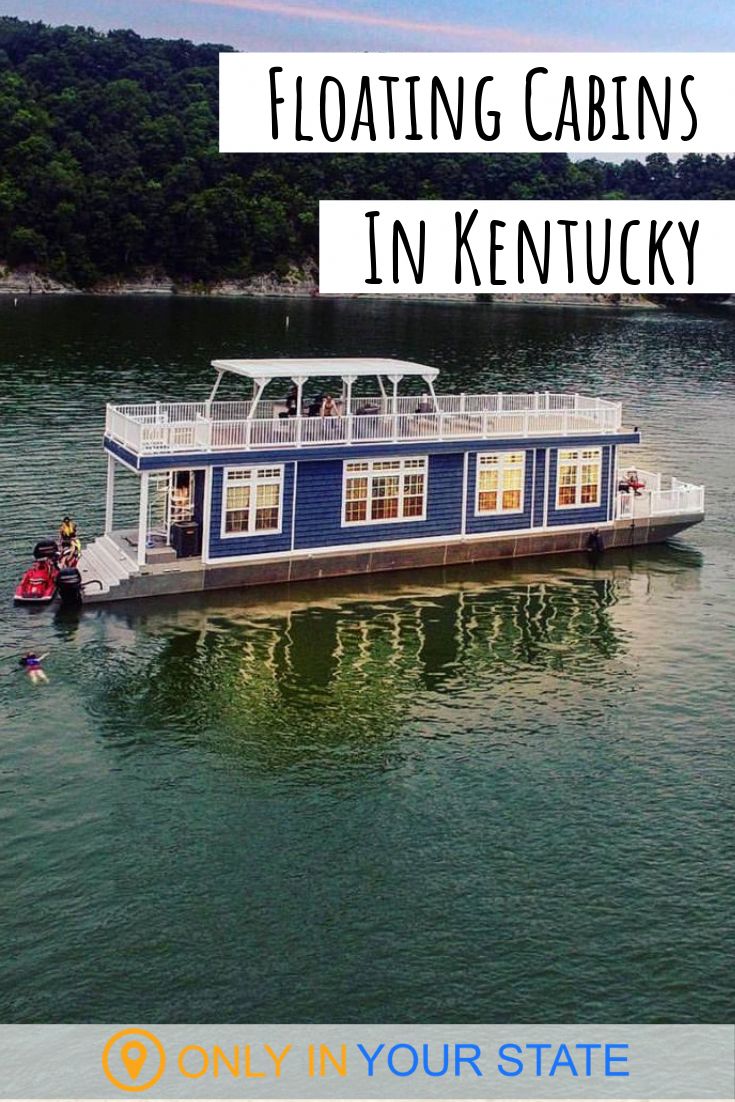 a house boat floating in the water with text overlay reading floating cabins in kentucky