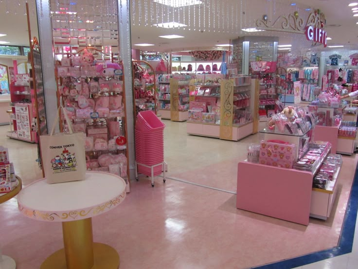 the inside of a toy store with pink furniture