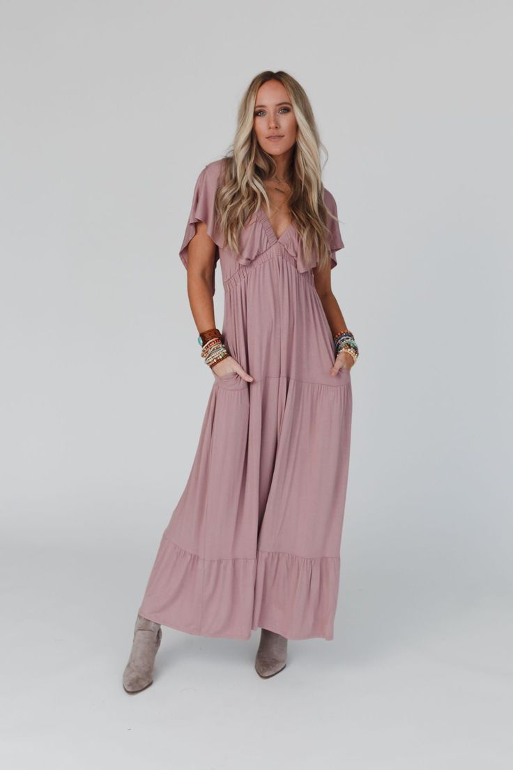 You're going to wear the On Repeat Open Back Ruffle Maxi Dress to every occasion because of how great it makes you feel! It's featured in a comfortable lightweight knit fabric in a maxi silhouette, tiered ruffle skirt, flattering ruffle v-neckline with ruffle sleeves, and an open back. Pair with a cute bralette like our Eye Of The Sun Padded Bralette for a cute boho outfit ready for any occasion! *Due to lighting and differences in monitors, actual colors may vary slightly from what appears onli Boho Outfit, Ruffle Maxi Dress, Tiered Ruffle Skirt, Padded Bralette, Mauve Dress, Ruffled Maxi Dress, Ruffle Sleeves, On Repeat, Ruffle Skirt