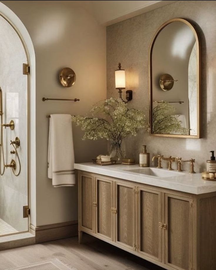 a bathroom with two sinks and mirrors in it