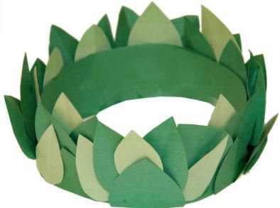 a paper crown with green leaves on it