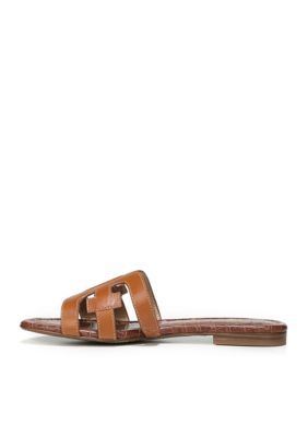 Sam Edelman's Bay Slide Sandal is warm-weather chic. Versatile and easy to match, it looks great from the poolside to the polo grounds. Wear with cutoff jeans or a simple, flowing sun dress. | Sam Edelman Women's Bay Sandals, 10M Flat Slides For Day Out In Spring, Spring Day Out Flat Slides, Casual Sandals For Poolside Vacation, Casual Sandals For Summer Outings, Chic Poolside Sandals For Spring, Casual Sandals For Spring And Summer Outings, Brown Slides For Spring, Brown Spring Slides, Trendy Sandals For Poolside Spring Occasion