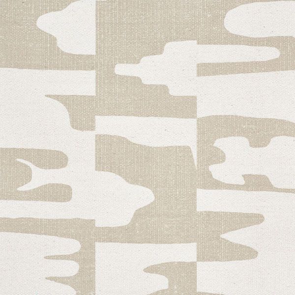 a beige and white abstract pattern on fabric