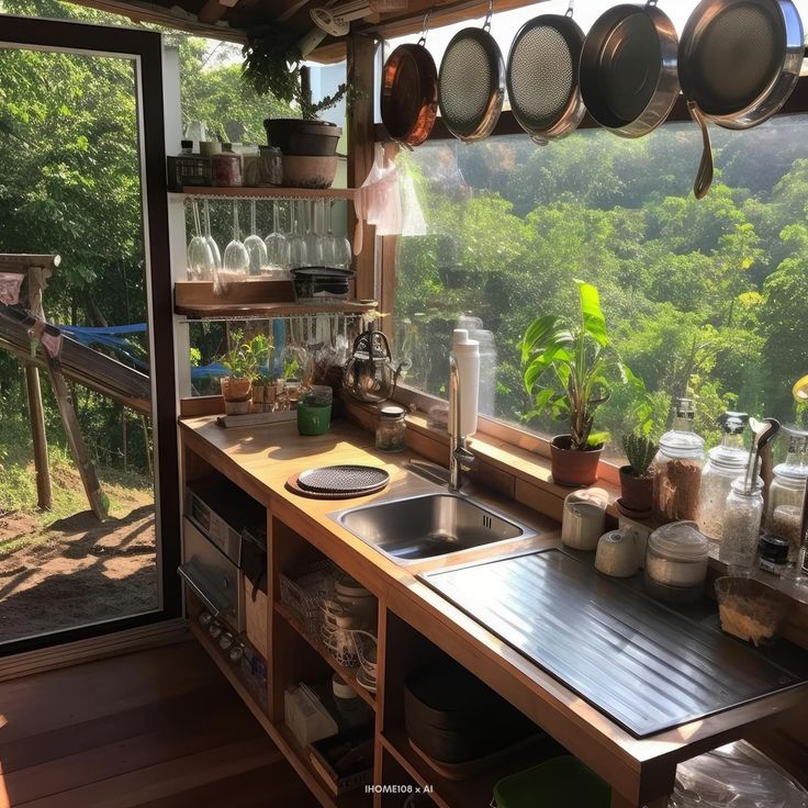 an outdoor kitchen with pots and pans hanging from the ceiling over the sink area