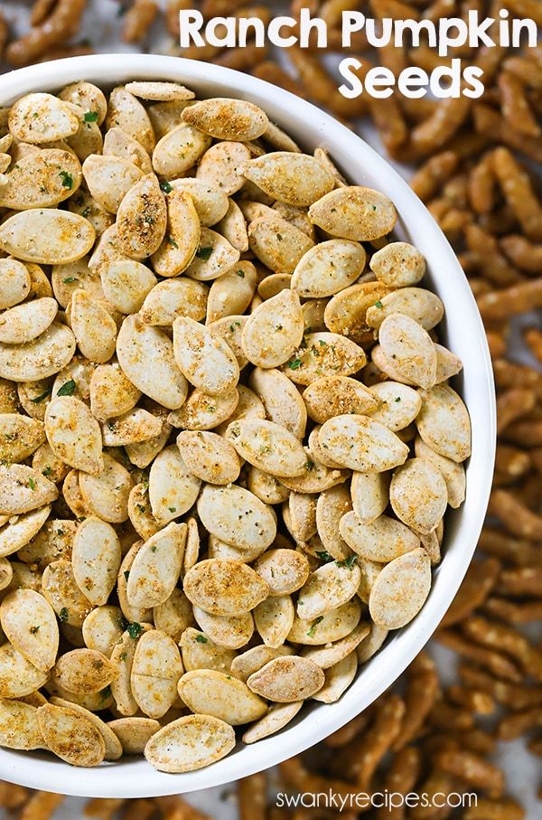 a white bowl filled with ranch pumpkin seeds