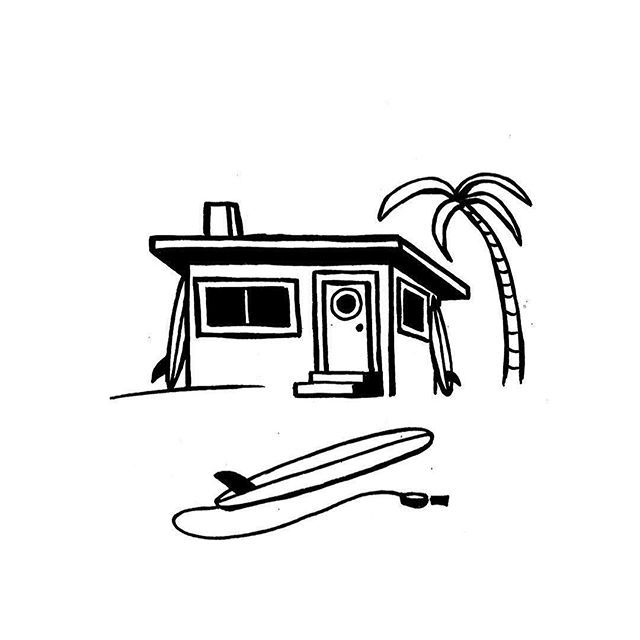 a house with a surfboard next to it and a palm tree in the background