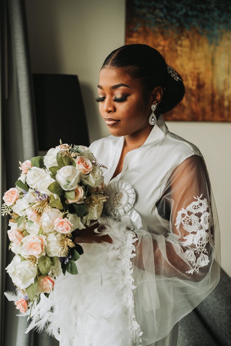 a woman in a wedding dress holding a bouquet