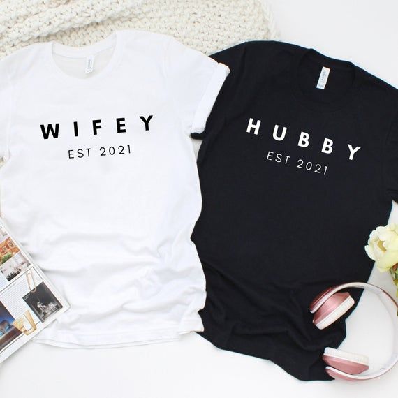 two t - shirts with the words wife and hubby printed on them