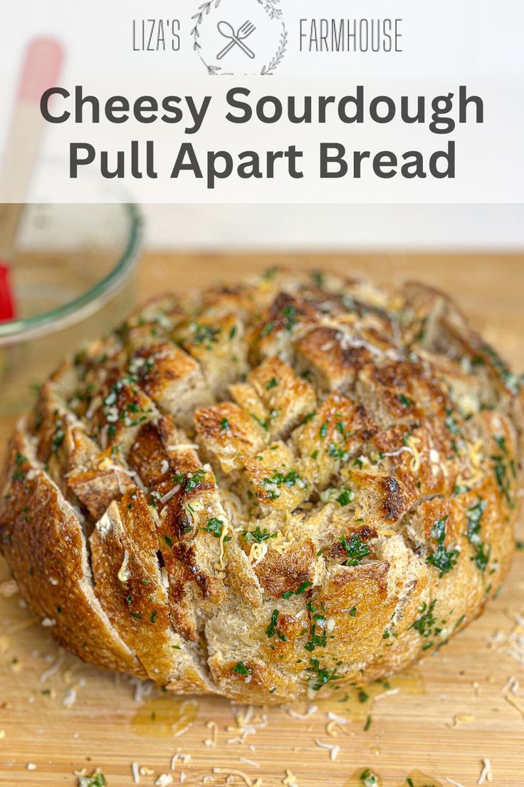 cheesy sourdough pull apart bread on a cutting board