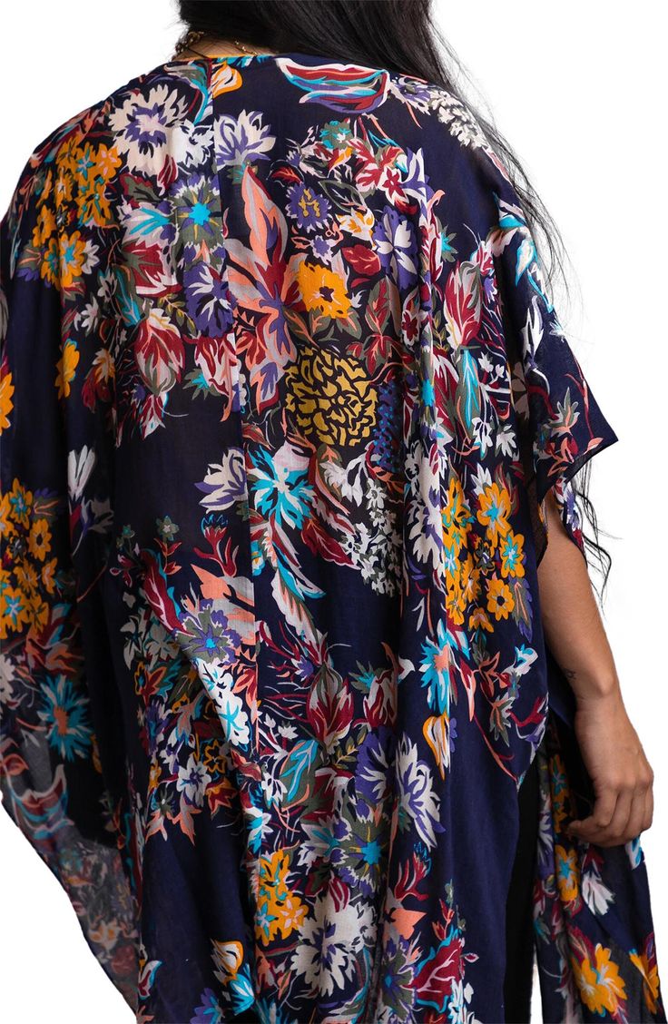 Easily layer this blossoming patterned knit duster over any outfit that needs a pop of color. 34" x 44" (size OS) No collar Elbow length sleeves Open front 100% rayon Hand wash Imported Model stats: 5'10" height, 32" bust, 25" waist, 36" hip. Model is wearing size OS. Multicolor Floral Print Open Front Outerwear, Multicolor Open Front Outerwear With Floral Print, Floral Print Open Front Outerwear For Beach, V-neck Floral Print Kimono For Fall, Multicolor Floral Print Kimono One Size, One Size Multicolor Floral Print Kimono, Multicolor Floral Outerwear With Kimono Sleeves, Floral Print Outerwear For Beach In Fall, Floral Print Outerwear For Fall Beach Outing