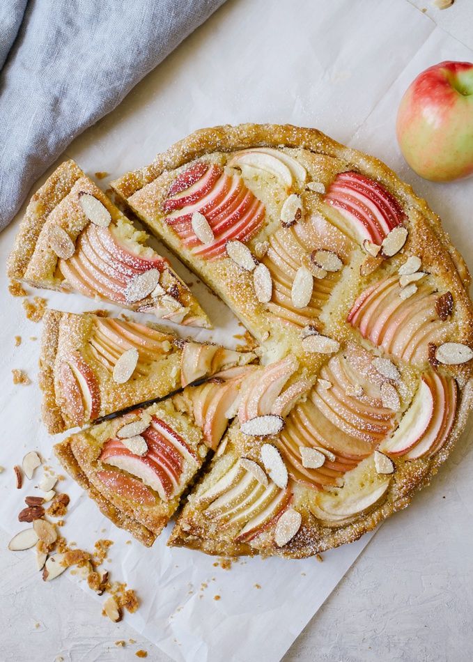 an apple pie is cut into slices and ready to be eaten